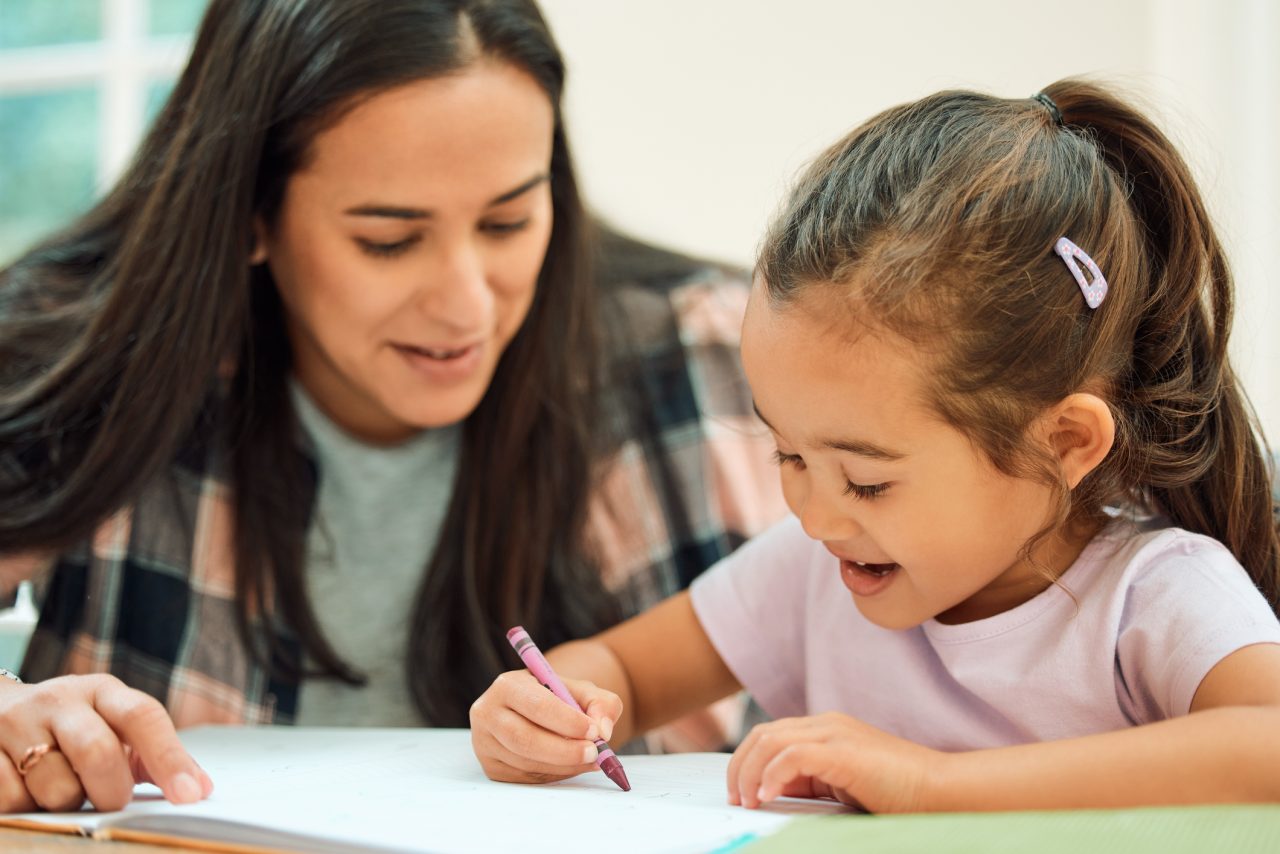 Tutor helping a student with learning disabilities using multisensory reading and math activities.