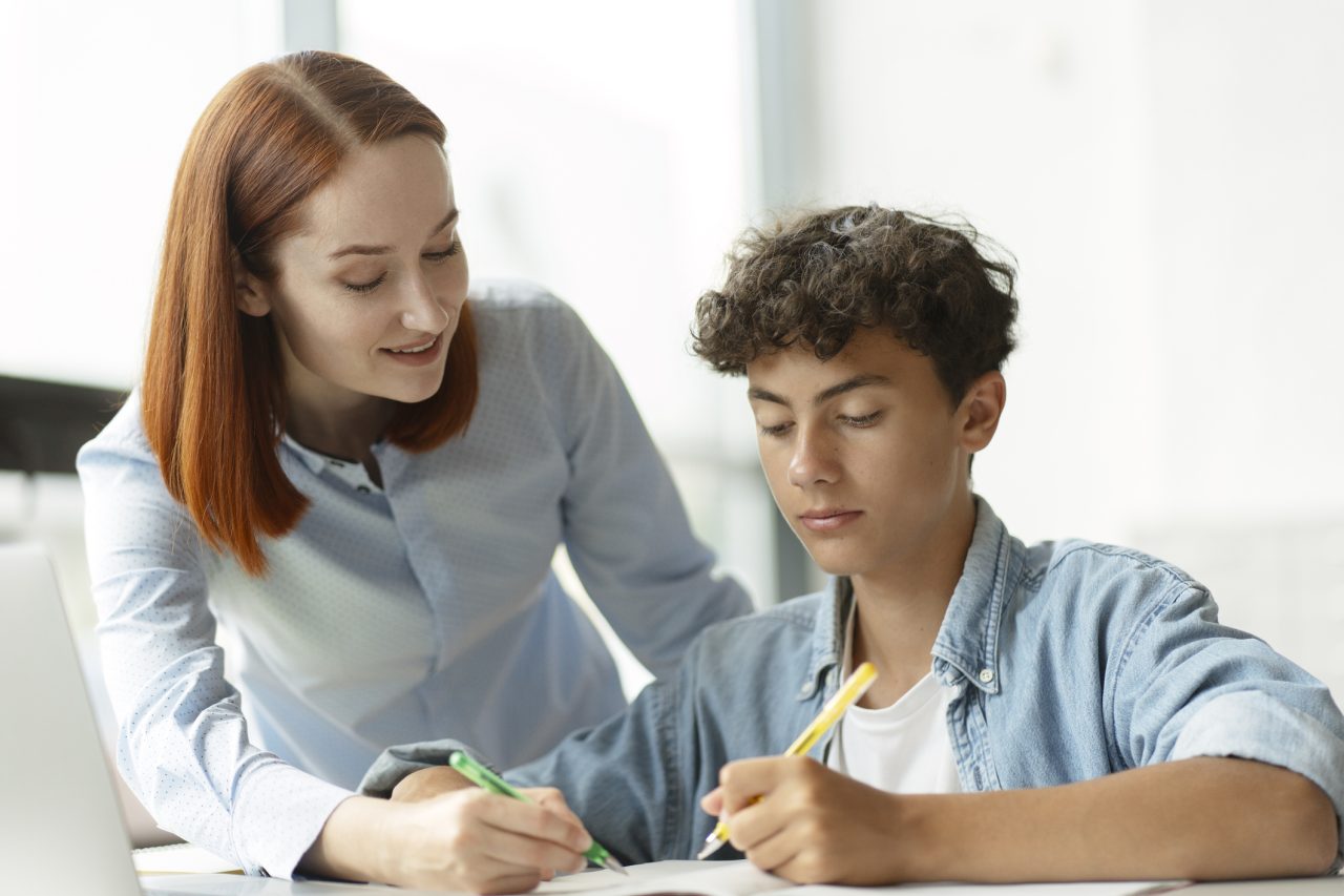 Tutor working one-on-one with a young student at Knowledge Plus Tutoring in Riverview, Florida.